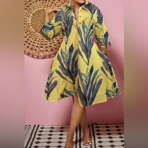 Dress with leaf print with pockets